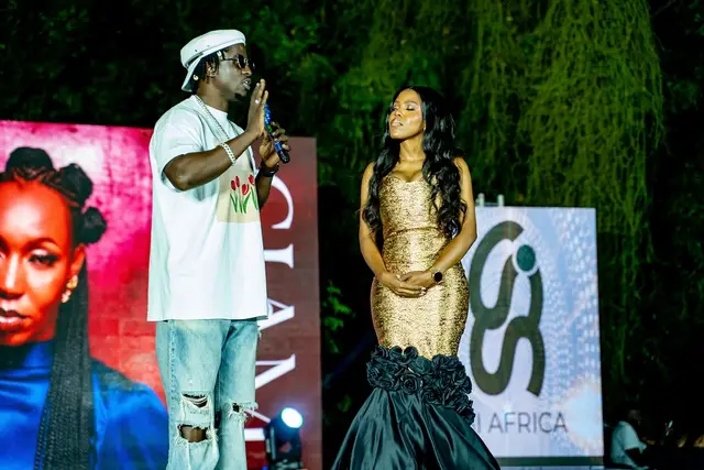 Host and guest on stage with the SSI Africa screen at BIT Expo 2025