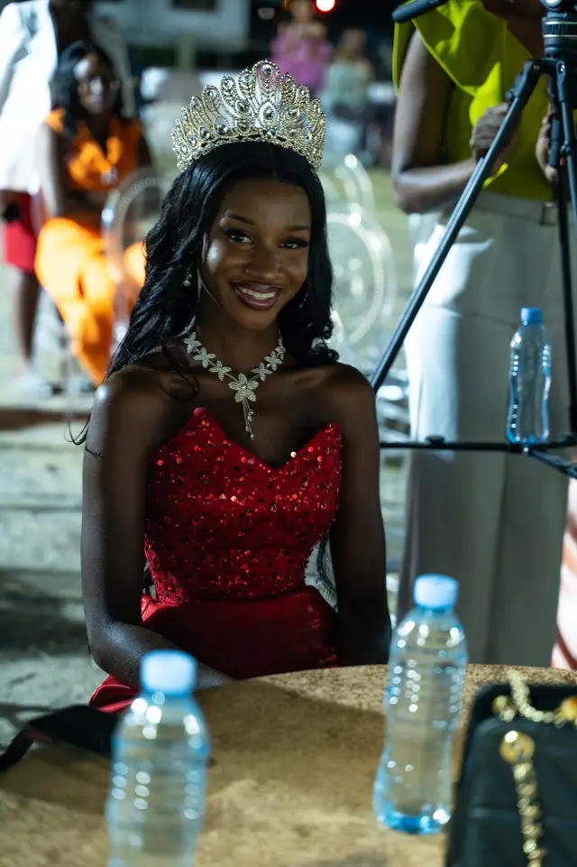 Crowned guest in a red sequined gown at BIT Expo 2025