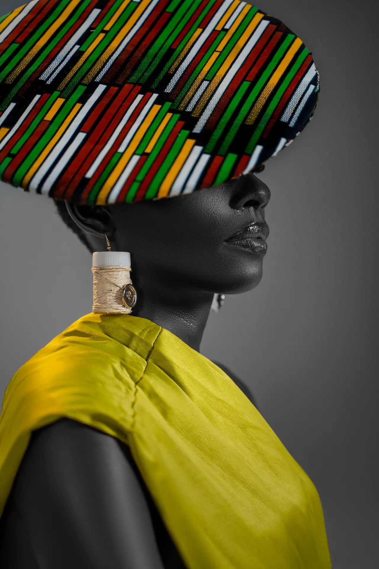 Profile beauty portrait with saffron drape and patterned hat