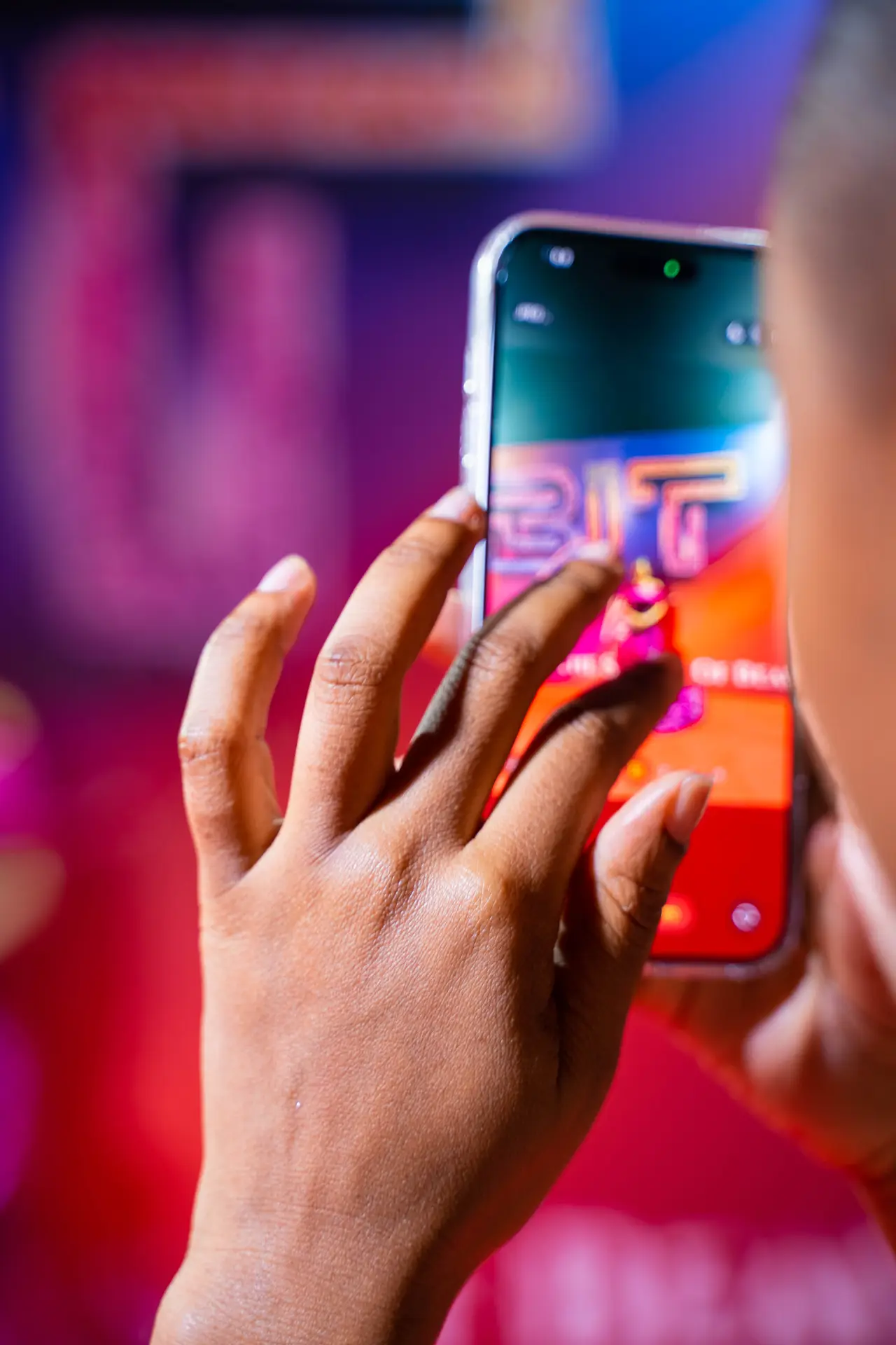 Guest recording the BIT Expo launch on a phone as the ad plays